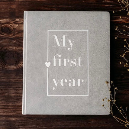 Light grey baby book "My first year"